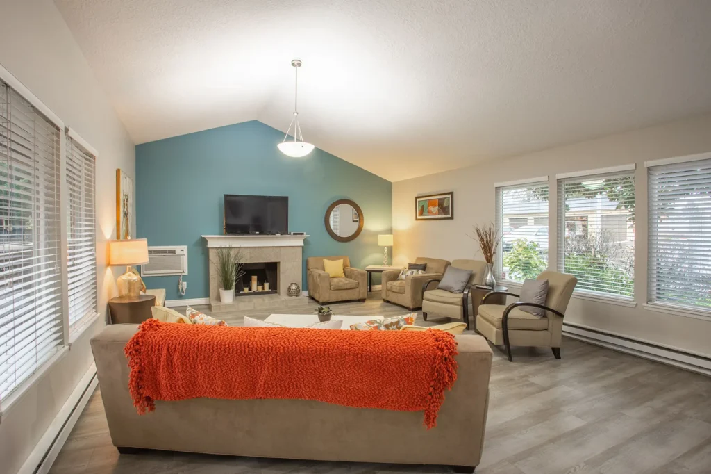 Clubhouse with lounge seating, fireplace, and TV