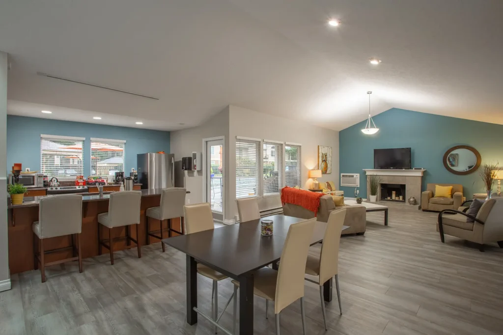 Clubhouse with kitchenette, lounge seating, fireplace, and TV